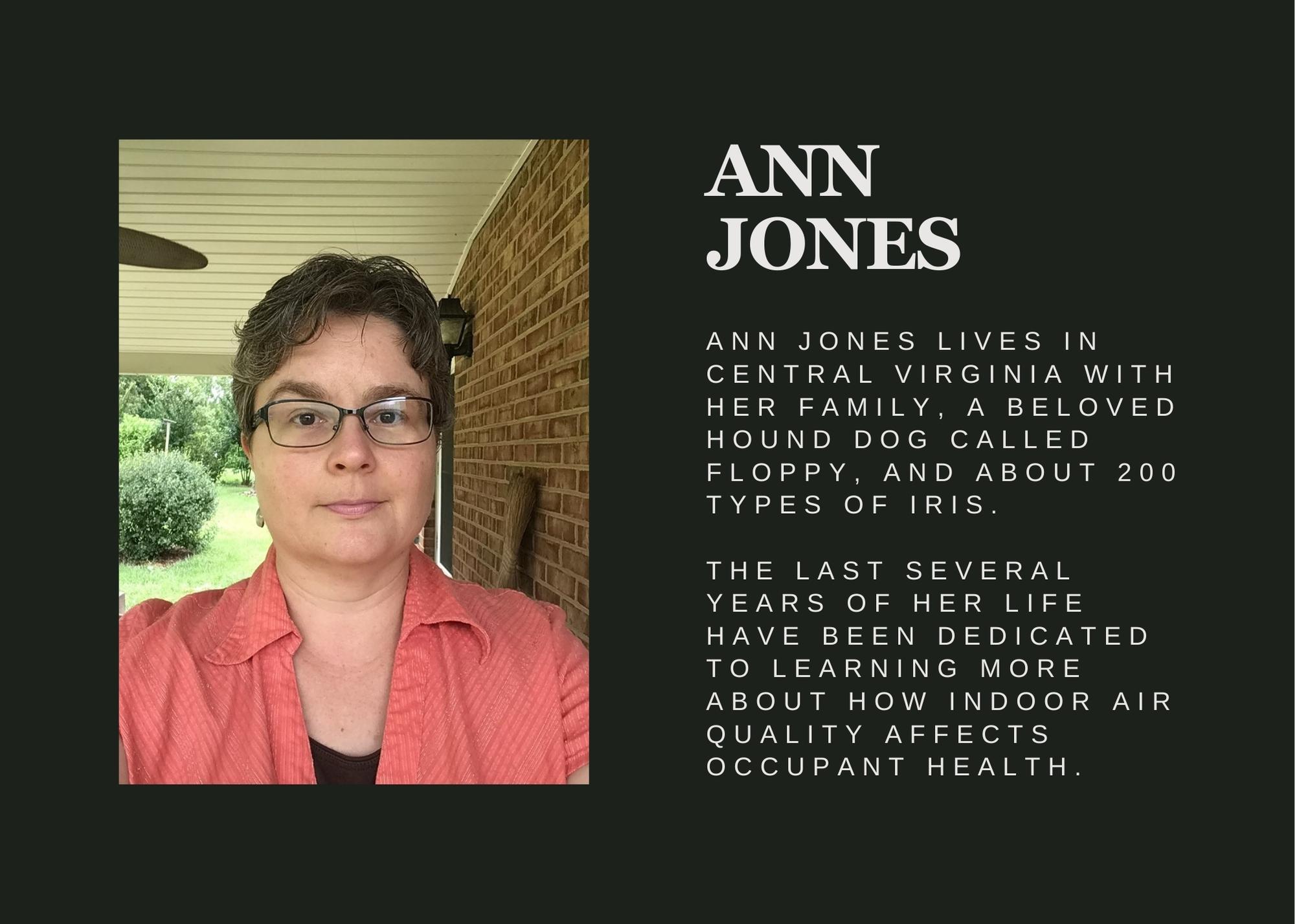 Author Ann Jones, a white woman in a red shirt with short hair and glasses