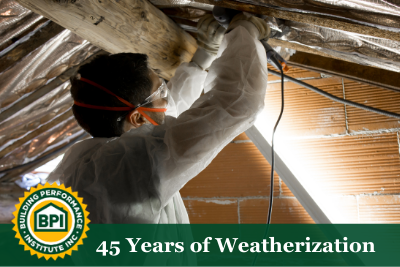 A technician installs insulation and vapor barriers to make a home more energy efficient